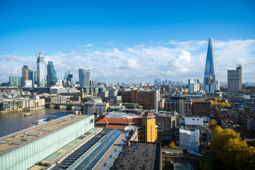 Bright scenic sunny daytime view of the developing skyline of the city of London, England, with new skyscrapers under construction