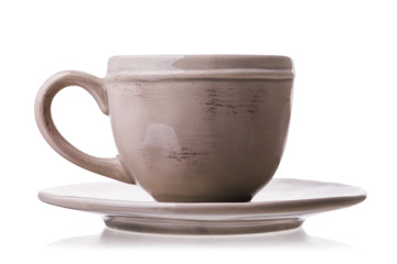 Ceramic cup with saucer isolated