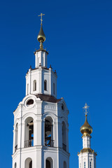 Fototapeta na wymiar Upper part of the church building against the blue sky