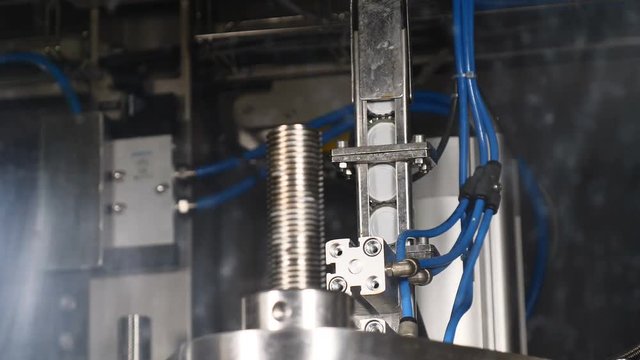 Set of bottle caps in Automatic Beer Bottling Line. Beer producing. Bottles on the Conveyor. 4k