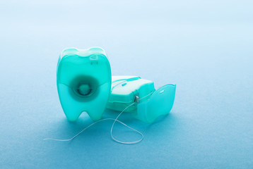 Dental floss on a blue background.