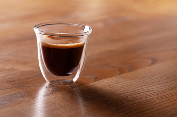 Сup of espresso coffee on wodden background