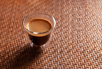 Сup of espresso coffee on wodden background