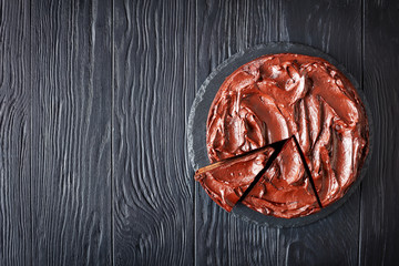 sliced chocolate Cake on a table