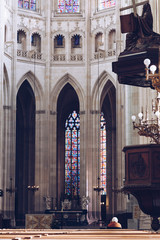 people praying - interior view of Saint Pierre Cathedral in Nantes - Nantes, FRANCE - NOVEMBER 2018.
