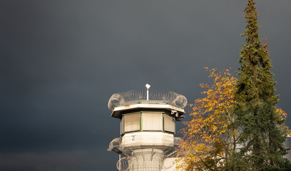 Watchtower of a correctional facility of a prison with a balustrade and two rows of barbed wire...