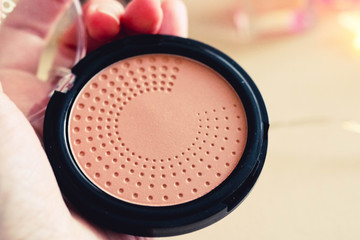 close-up view of face powder with blured background