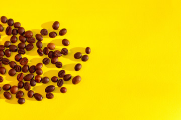 Coffee Seeds Over Yellow Background. Abstract Colorful Background. Food And Drinks Concept.
