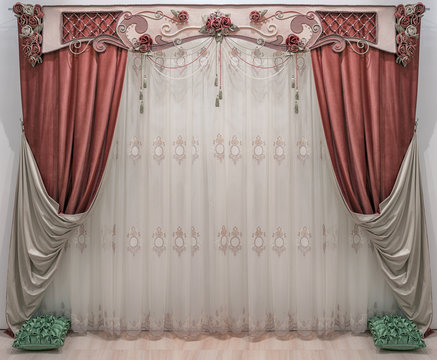 An interior in the classical, palace style. Double-sided curtains. Pelmet is decorated flowers, beads and cords.
