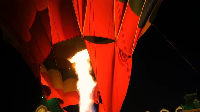 Close up shot - fire from gas jet burner in hot air balloon at night