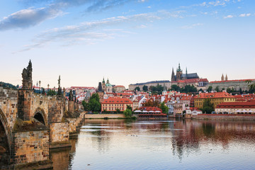 .Evening in Prague. View of Prague Castle, Charles Bridge and the Vltava River Embankment. Czech...