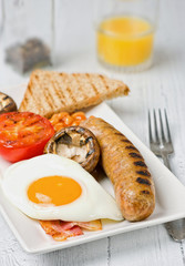 Classic English breakfast served. Close view.