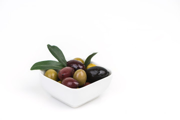 Different colors olives in a white background.