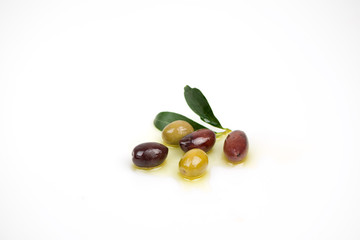 Different colors olives in a white background.