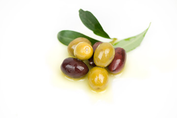 Different colors olives in a white background.