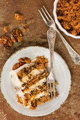 Carrot and walnut cake with cream cheese frosting slice top view