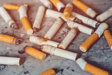 smoking a cigarette. pulverize the floor.	