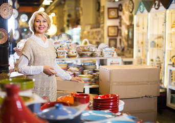 woman buying ceramic ware