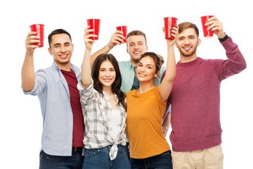 celebration, friendship and people concept - group of smiling friends with non alcoholic drinks in...