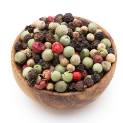 Pepper mix seed on spoon on white background.