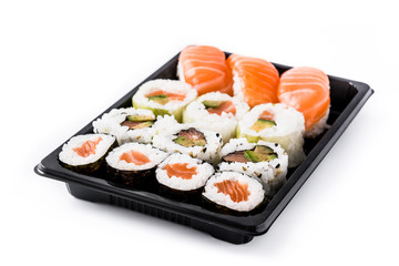 sushi assortment on black tray isolated on white background