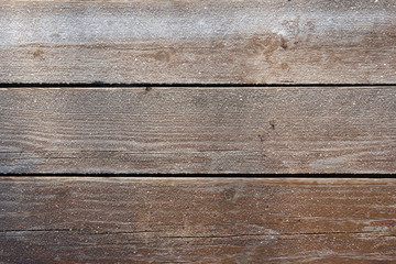 Frozen wood boards background. It is real foto in sunny frosty day