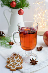 Hot drink with cranberries and christmas cookies