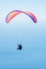 Paraglider over the sea. Russia, Republic of Crimea. 06.13.2018. Flight of a paraglider athlete above the sea
