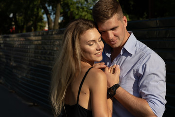 happy couple in love hugging and holding hands, summer date