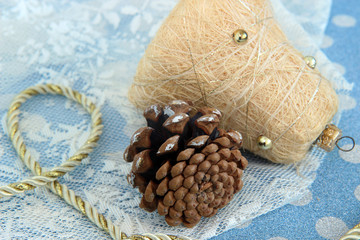 pine cones and bell on winter background