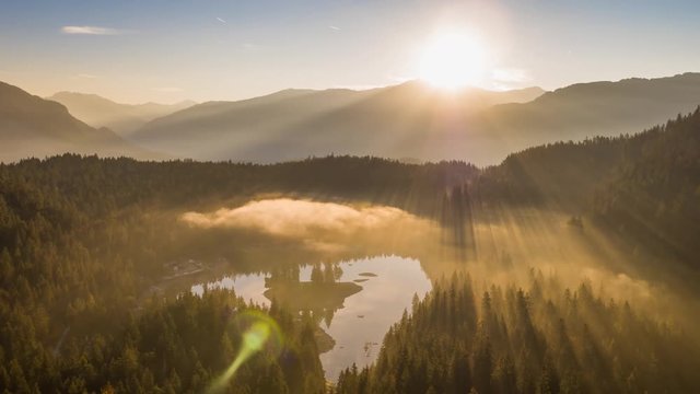 Aerial footage from the beautiful Lake Cauma surrounded by the mountains, located in Flims, Switzerland. Filmed during the sunrise with the DJI Inspire 2 drone in 5.2k RAW and downscaled to 4k.
