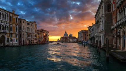 Fototapeten Sunrise in Venice. Image of Grand Canal in Venice, with Santa Maria della Salute Basilica in the background. Venice is a popular tourist destination of Europe. Venice, Italy. © daliu