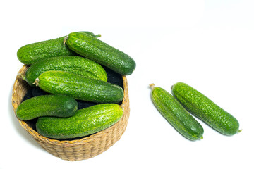 Fresh , green cucumbers in box isolated on white background