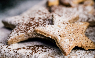 Star shaped christmas cookies decorated sugar and cocoa powder