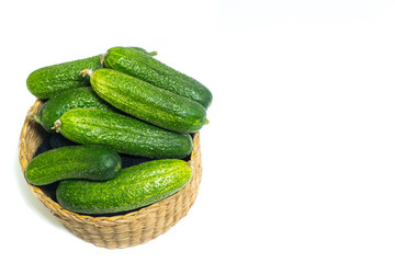 Fresh , green cucumbers in box isolated on white background