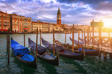 Fototapeta na wymiar Sunrise in San Marco square, Venice, Italy. Venice Grand Canal. Architecture and landmarks of Venice. Venice postcard with Venice gondolas