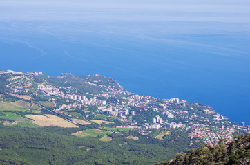 Resort town on the seashore. Russia, the Republic of Crimea. 13.06.2018. Town of Gaspra. View from Mount Ai-Petri