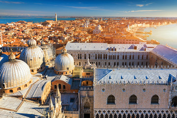 Fototapeta na wymiar Venice panoramic aerial view with red roofs, Veneto, Italy. Aerial view of the Venice city, Italy. Venice is a popular tourist destination of Europe. Venice, Italy.
