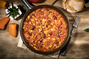 Chili con carne in a clay pan.