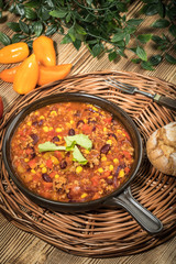 Chili con carne in a clay pan.