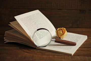 Book and magnifying glass