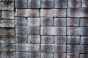 Wall of grey bricks texture