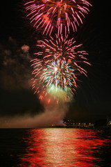 Colorful firework bursting over the river