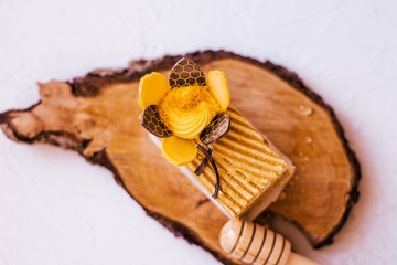 Honey cake with teapot. Spring mood. Coffee break. Dessert on white background.Sweet dish on cut of...