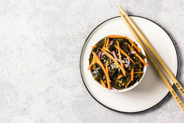 Spicy seaweed ginger carrot salad. Top view, space for text.