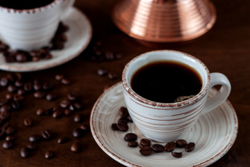 Coffee cups and copper Turk on the table