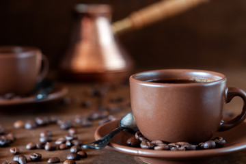 Coffee cups and copper Turk on the table