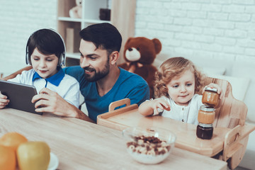Fototapeta premium ather of Boys is Engaged in Raising Children