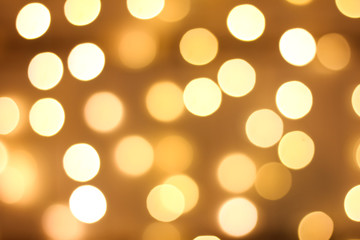 Defocused gold abstract christmas background. Golden and yellow circle background