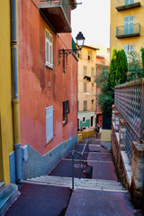 Fototapeta na wymiar Old city street, narrow streets and buildings, Nice, France